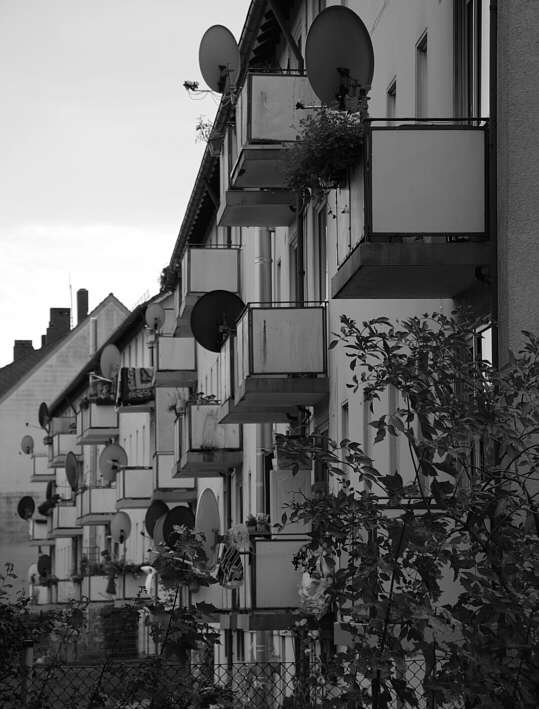 rear of an apartment block in a suburb