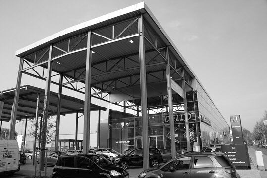 a huge canopy in front of the entrance of a big car dealership