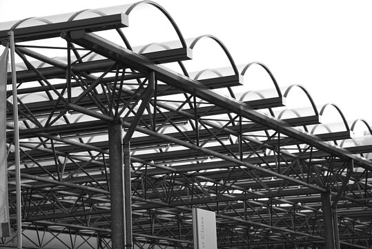 a part of an extended canopy which is in front of the greater part of the façade of a car dealership
