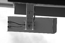 A surveillance camera on the front of an office block of a security contractor